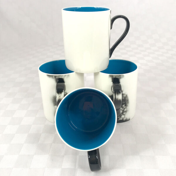 ceramic white and blue mugs