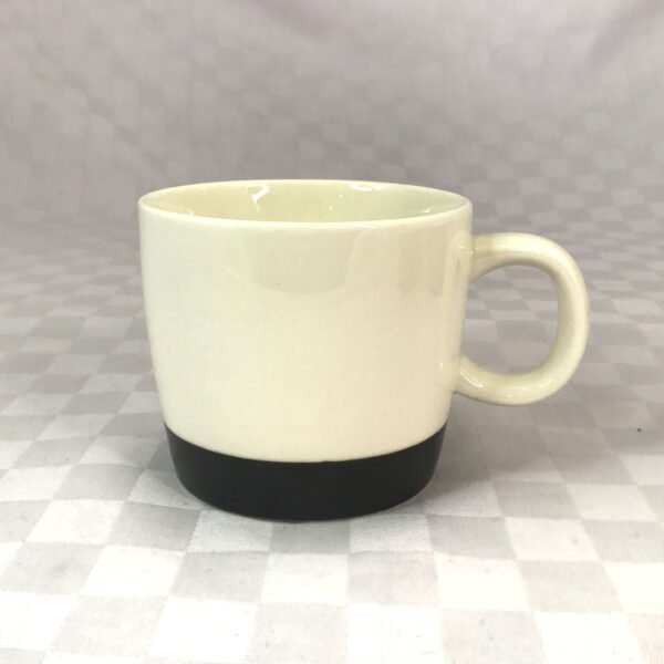 cream and green ceramic mug